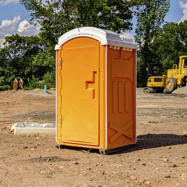 what is the cost difference between standard and deluxe portable restroom rentals in Dickinson Center
